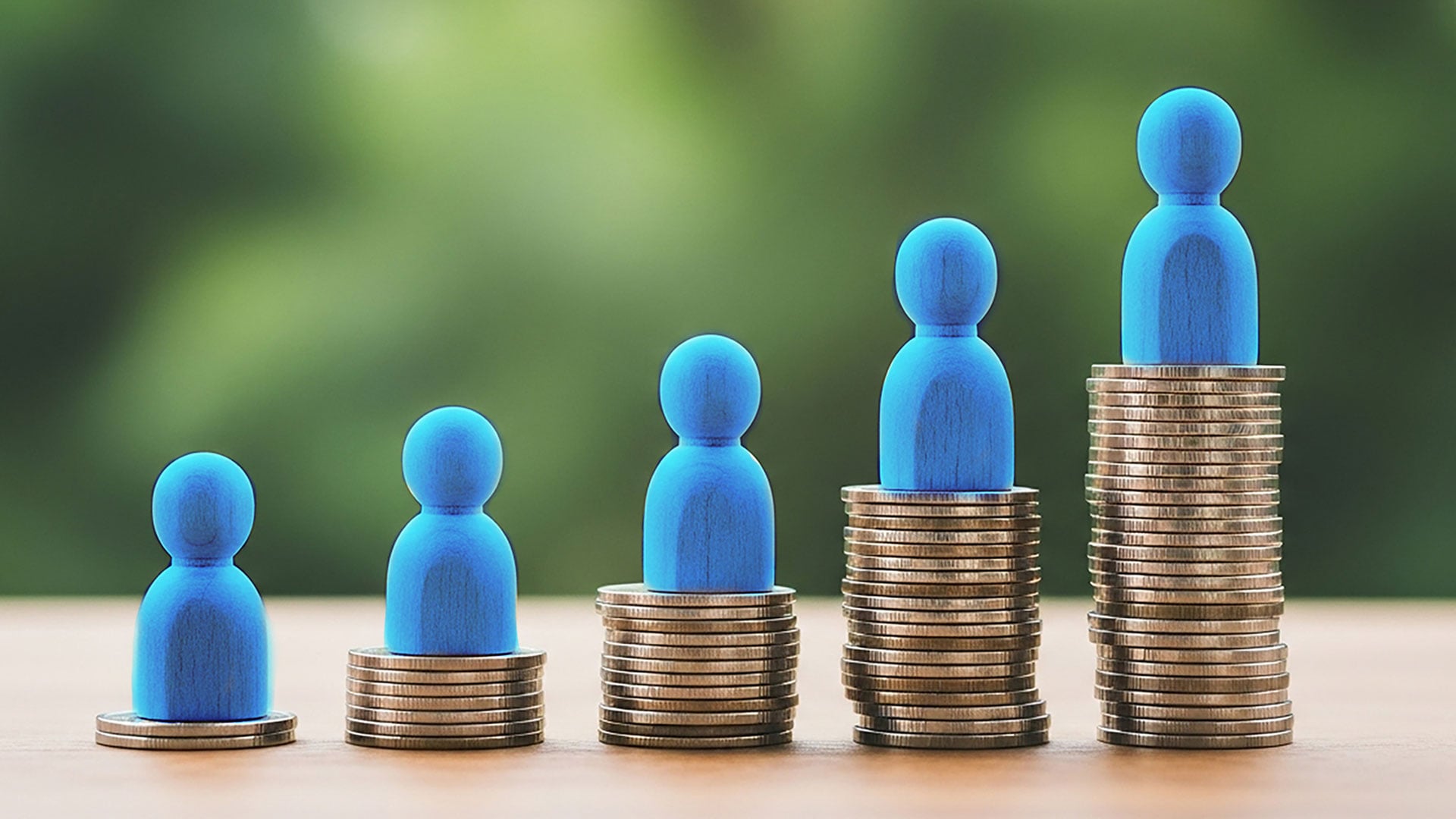 Block people on a stack on coins